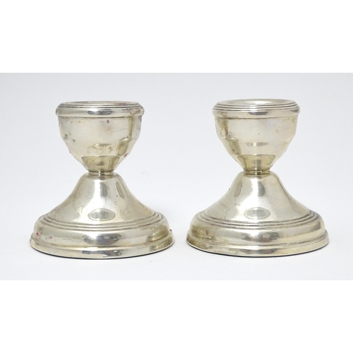 343 - A pair of short silver candlesticks hallmarked Birmingham 1977 with Silver Jubilee mark, maker W. I.... 