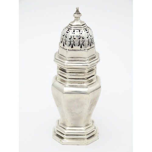 406 - A silver caster of octagonal form hallmarked London 1916, maker Crichton Brothers. Approx. 6 1/4