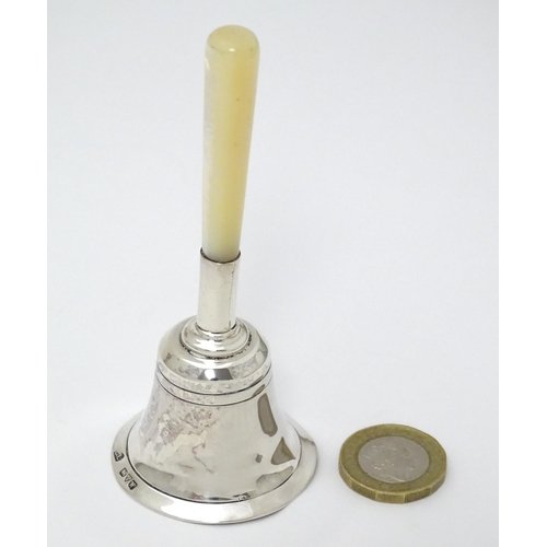 408 - A silver hand / table bell with mother of pearl handle, hallmarked Chester 1922, maker Colen Hewer C... 