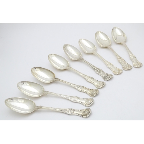 520 - Eight associated Victorian silver Kings pattern table spoons comprising two hallmarked London 1848 m... 