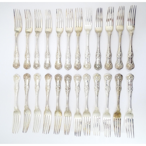 521 - Twenty four associated Victorian silver Kings pattern table forks comprising eight hallmarked London... 