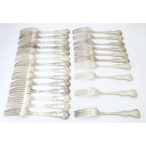 521 - Twenty four associated Victorian silver Kings pattern table forks comprising eight hallmarked London... 