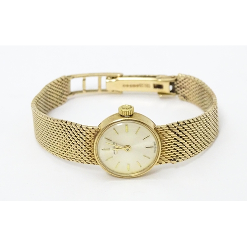 772 - A ladies 9ct gold cased Longines wristwatch with 9ct gold strap. Watch dial approx. 5/8