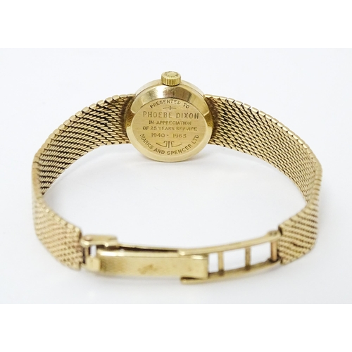 772 - A ladies 9ct gold cased Longines wristwatch with 9ct gold strap. Watch dial approx. 5/8