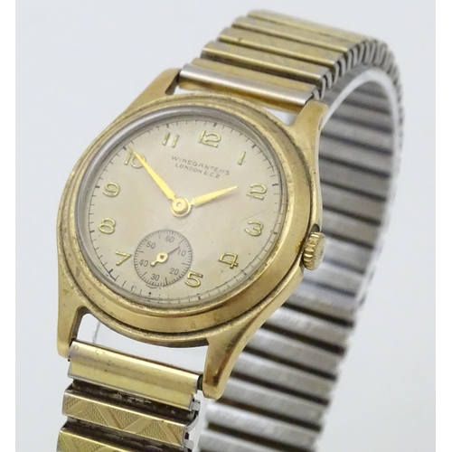 775 - A 9ct gold cased gentlemans wristwatch with Arabic numeral and subsidiary seconds dial, the dial sig... 