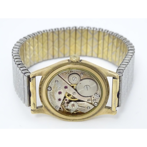 775 - A 9ct gold cased gentlemans wristwatch with Arabic numeral and subsidiary seconds dial, the dial sig... 