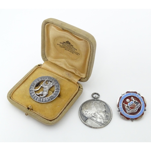 776 - Three assorted items comprising white metal badge titled Berlin Golf Club Founded 1895, a silver bad... 