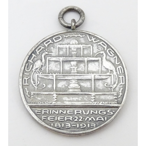 776 - Three assorted items comprising white metal badge titled Berlin Golf Club Founded 1895, a silver bad... 