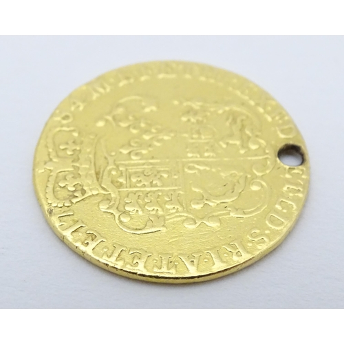 778 - Coin: A Victorian 1869 gold half sovereign coin. Approx. weight 4g. Together with a coin formed fob ... 