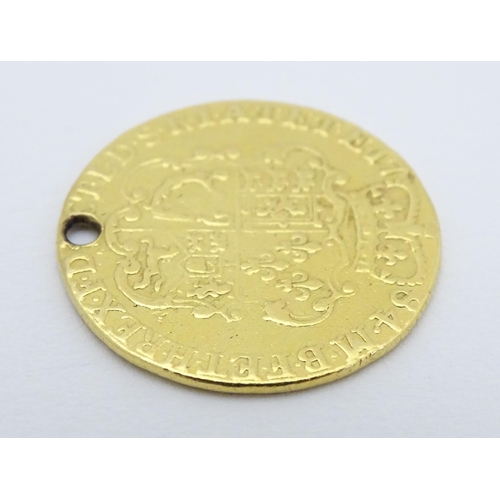 778 - Coin: A Victorian 1869 gold half sovereign coin. Approx. weight 4g. Together with a coin formed fob ... 