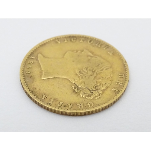 778 - Coin: A Victorian 1869 gold half sovereign coin. Approx. weight 4g. Together with a coin formed fob ... 