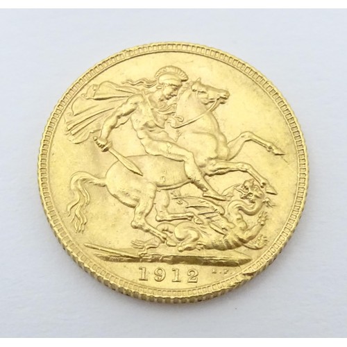 779 - Coin: A George V 1912 gold sovereign coin. Total weight approx. 8g