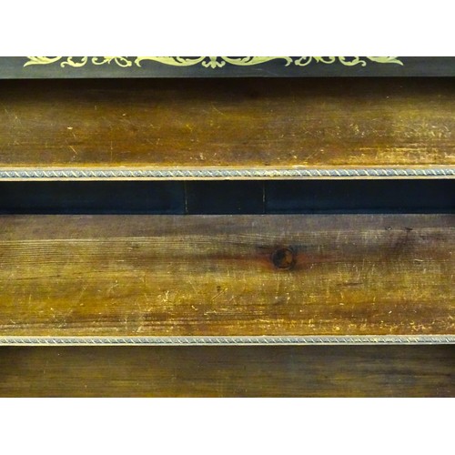 1335 - A 19thc mahogany bookcase surmounted by a brass gallery and with inlaid brass decoration. The bookca... 