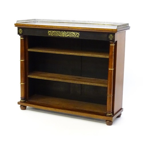 1335 - A 19thc mahogany bookcase surmounted by a brass gallery and with inlaid brass decoration. The bookca... 