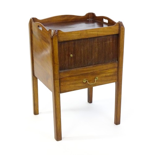 1338 - A late Georgian mahogany tray top table with pierced handles and a tambour front above a single shor... 