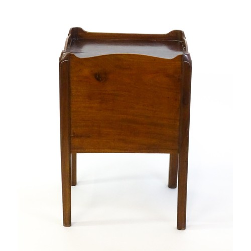 1338 - A late Georgian mahogany tray top table with pierced handles and a tambour front above a single shor... 