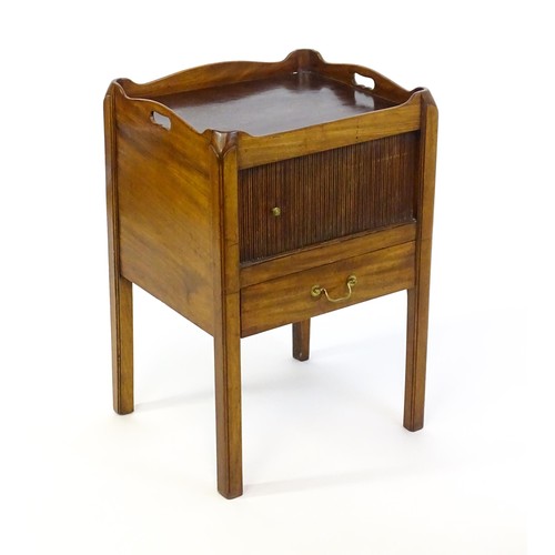 1338 - A late Georgian mahogany tray top table with pierced handles and a tambour front above a single shor... 