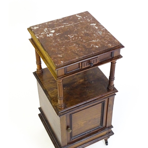 1343 - A late 19thC rosewood cabinet with a rouge marble top above a short frieze drawer and moulded under ... 