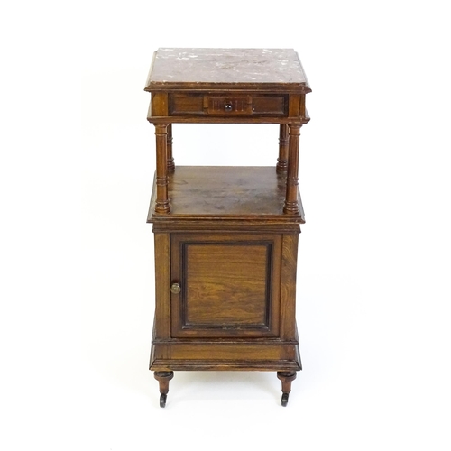 1343 - A late 19thC rosewood cabinet with a rouge marble top above a short frieze drawer and moulded under ... 