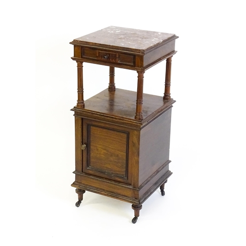 1343 - A late 19thC rosewood cabinet with a rouge marble top above a short frieze drawer and moulded under ... 