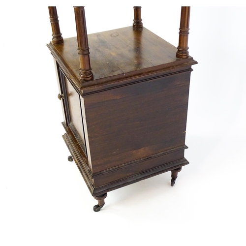 1343 - A late 19thC rosewood cabinet with a rouge marble top above a short frieze drawer and moulded under ... 