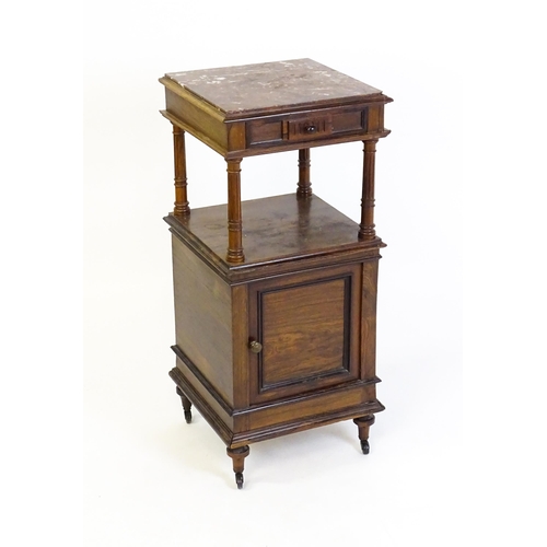 1343 - A late 19thC rosewood cabinet with a rouge marble top above a short frieze drawer and moulded under ... 