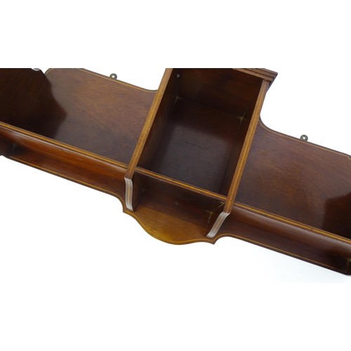 1345 - An Edwardian mahogany hanging wall shelf with decorative satinwood inlay. Bearing label to reverse. ... 