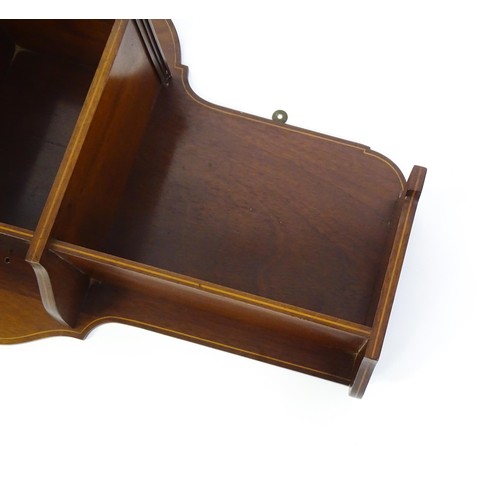 1345 - An Edwardian mahogany hanging wall shelf with decorative satinwood inlay. Bearing label to reverse. ... 