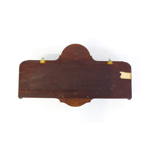 1345 - An Edwardian mahogany hanging wall shelf with decorative satinwood inlay. Bearing label to reverse. ... 