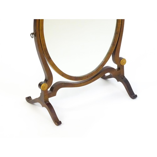 1347 - An early 20thC walnut skeleton mirror with a burr veneered frame and applied roundels. 16