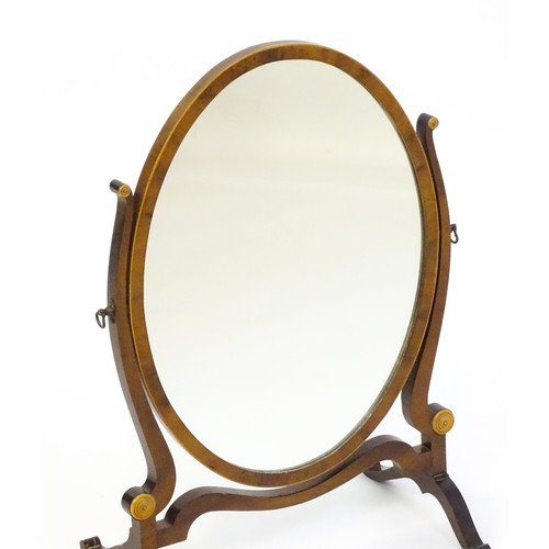 1347 - An early 20thC walnut skeleton mirror with a burr veneered frame and applied roundels. 16