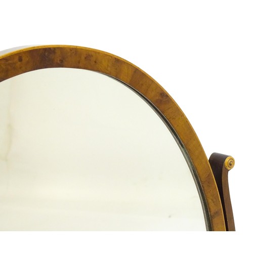 1347 - An early 20thC walnut skeleton mirror with a burr veneered frame and applied roundels. 16