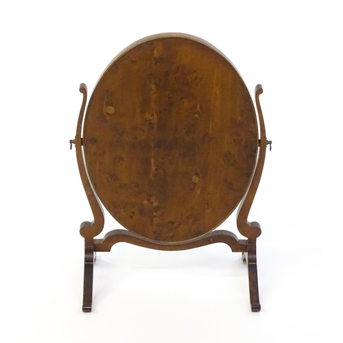 1347 - An early 20thC walnut skeleton mirror with a burr veneered frame and applied roundels. 16