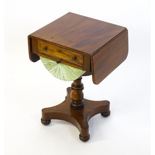 1355 - A 19thC mahogany work table with two drop leaves above a single short drawer with a fitted interior ... 