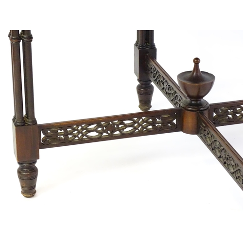 1357 - A late 19thC mahogany centre table, with a circular top above a pierced frieze and stretchers in the... 