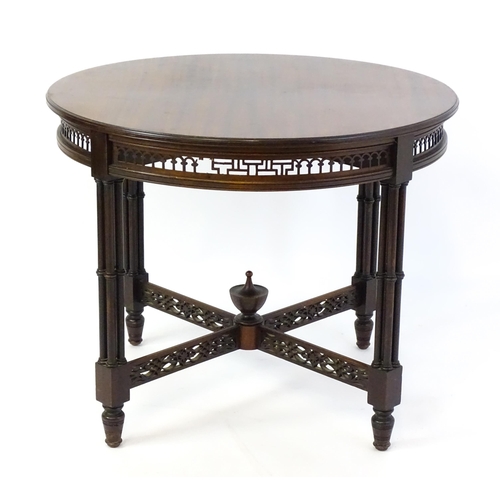 1357 - A late 19thC mahogany centre table, with a circular top above a pierced frieze and stretchers in the... 