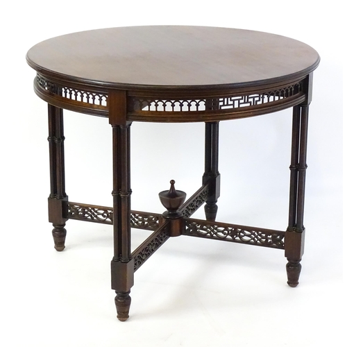 1357 - A late 19thC mahogany centre table, with a circular top above a pierced frieze and stretchers in the... 