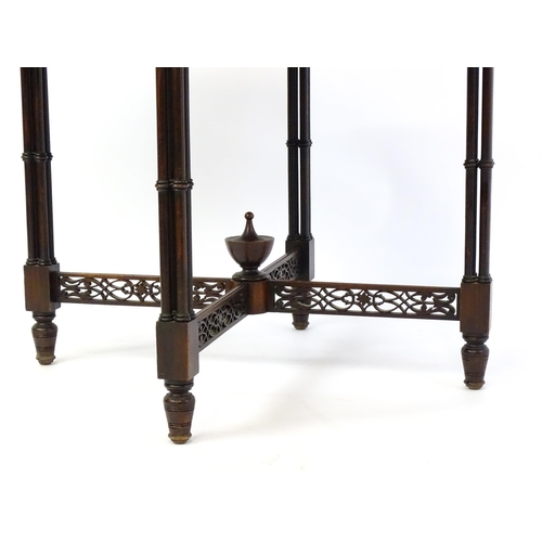 1357 - A late 19thC mahogany centre table, with a circular top above a pierced frieze and stretchers in the... 