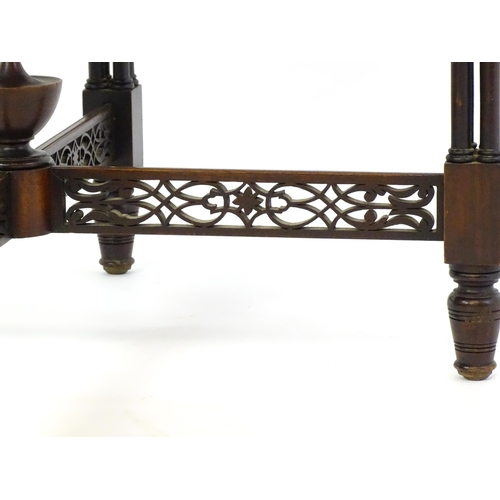 1357 - A late 19thC mahogany centre table, with a circular top above a pierced frieze and stretchers in the... 