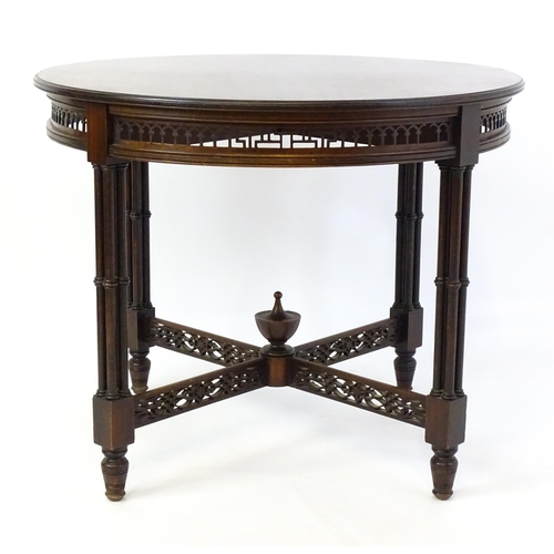 1357 - A late 19thC mahogany centre table, with a circular top above a pierced frieze and stretchers in the... 