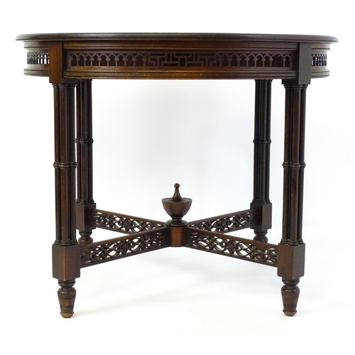 1357 - A late 19thC mahogany centre table, with a circular top above a pierced frieze and stretchers in the... 