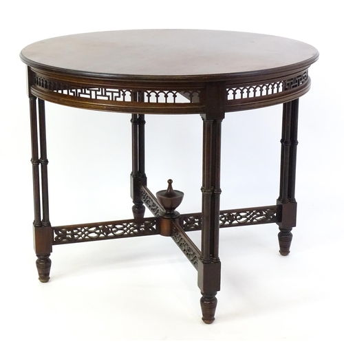 1357 - A late 19thC mahogany centre table, with a circular top above a pierced frieze and stretchers in the... 