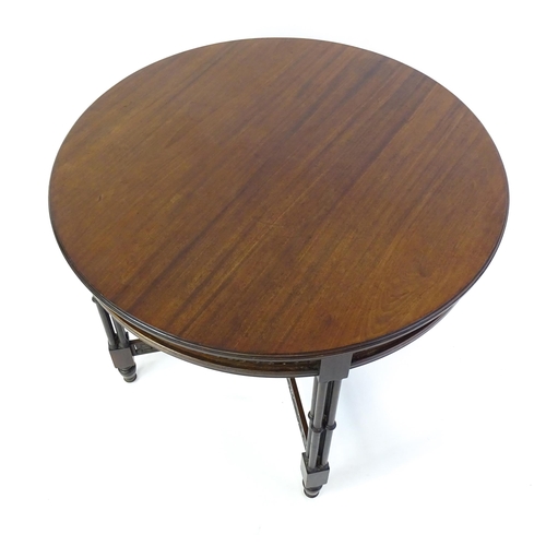 1357 - A late 19thC mahogany centre table, with a circular top above a pierced frieze and stretchers in the... 