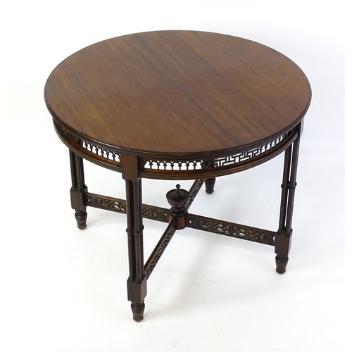 1357 - A late 19thC mahogany centre table, with a circular top above a pierced frieze and stretchers in the... 