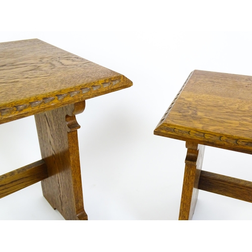 1359 - An oak Cotswold school nest of tables with carved edges, shaped supports and H - stretchers. 28