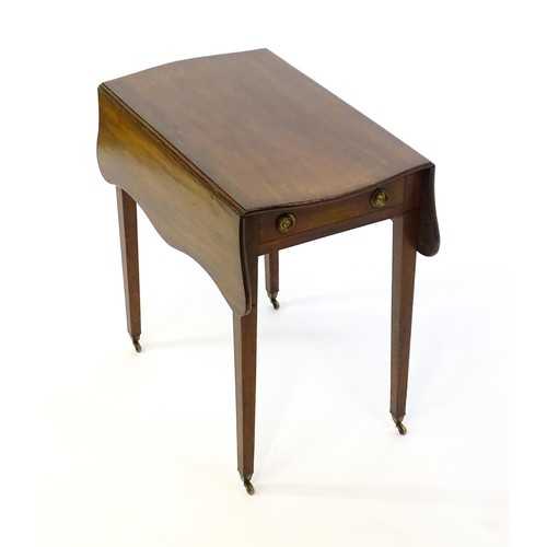 1360 - A 19thC mahogany Pembroke table with two drop leaves, a short frieze drawer with ring pull handles a... 