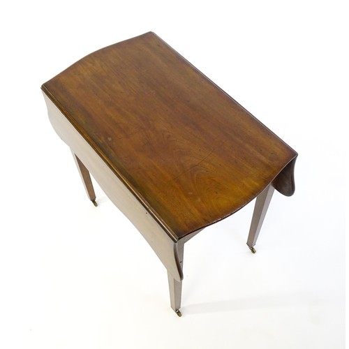 1360 - A 19thC mahogany Pembroke table with two drop leaves, a short frieze drawer with ring pull handles a... 