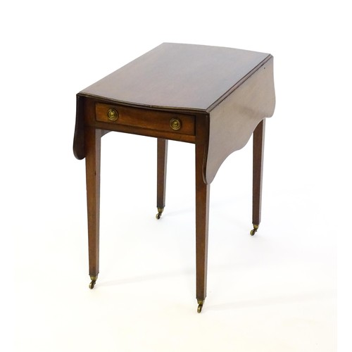 1360 - A 19thC mahogany Pembroke table with two drop leaves, a short frieze drawer with ring pull handles a... 