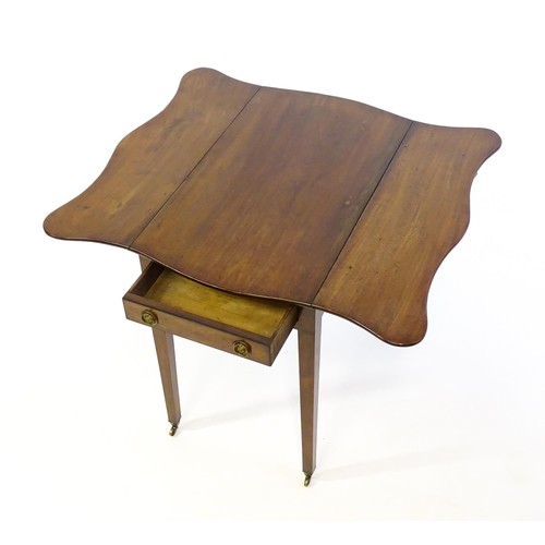 1360 - A 19thC mahogany Pembroke table with two drop leaves, a short frieze drawer with ring pull handles a... 