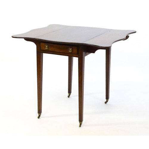 1360 - A 19thC mahogany Pembroke table with two drop leaves, a short frieze drawer with ring pull handles a... 